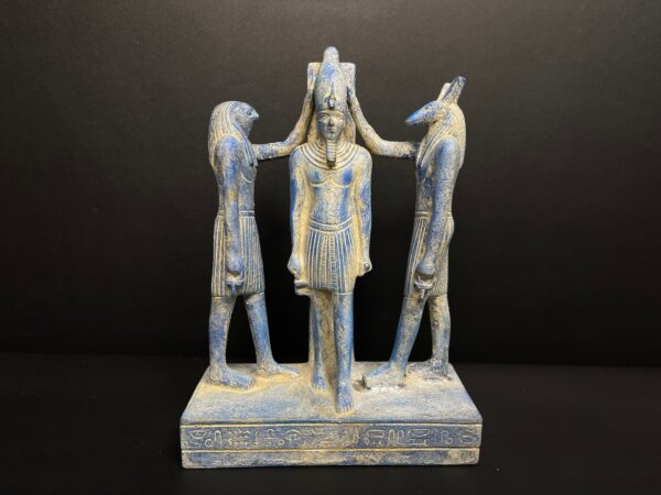 the triad of Rameses III, the god Horus and the god Seth performing the ...